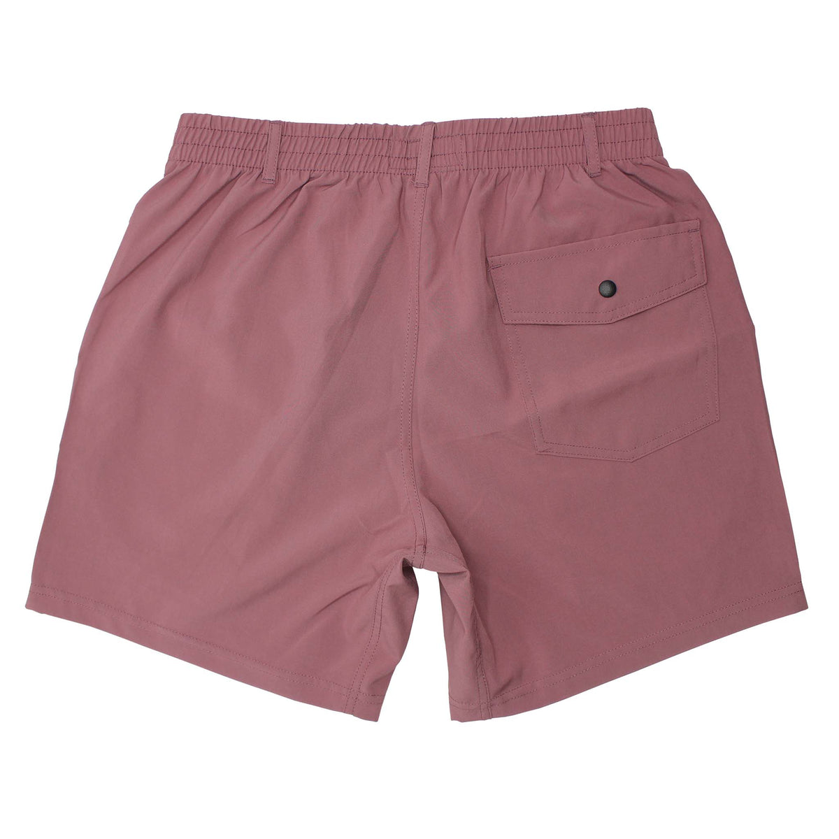 Back view of Local Boy Volley Shorts in Mauve. The back pocket features a button snap closure.